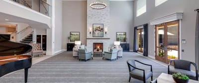 Common area with seating around a fireplace