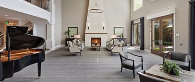 Elegant common area with a fireplace and piano