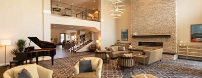 Spacious common area with modern furniture and fireplace