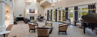 Elegant common area with seating and piano.
