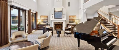 Elegant interior common area with a piano and seating