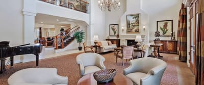 Well-furnished lobby area with seating and decor