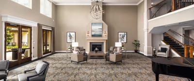 Spacious lobby with comfortable seating and a fireplace