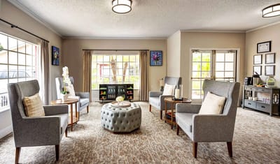 Cozy common area with seating and natural light.