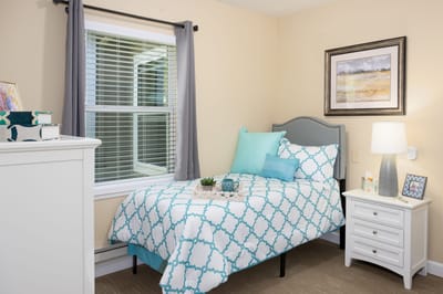 Cozy resident room with a bed and decor