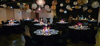 A beautifully decorated dining area for an event.