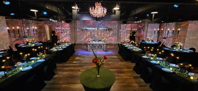 Elegant dining setup with tables and floral arrangements