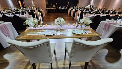 Elegantly set dining tables with floral centerpieces
