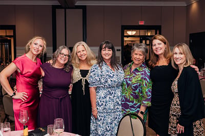Group of women celebrating together at an event.