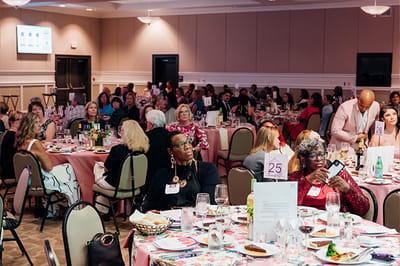 Residents and staff enjoying a community event dinner.