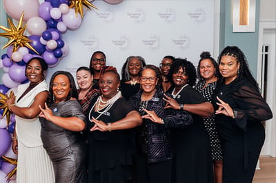 Group of staff members celebrating at Samaritan Village