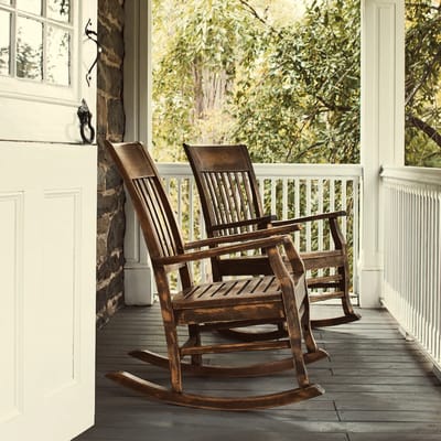 Two rocking chairs on a porch