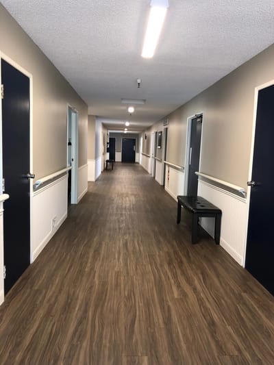 Interior hallway with doors and lighting