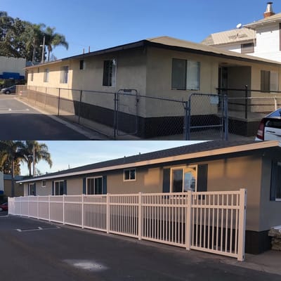 Exterior view of a building and fence.