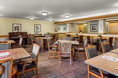 Common area with dining tables and decor.