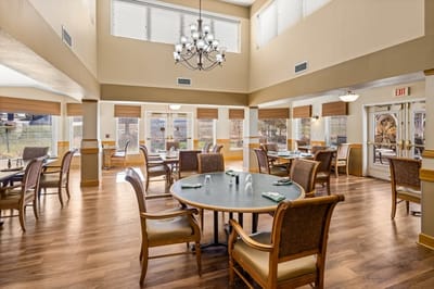 Dining room with tables and chairs.