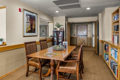 Interior view of a common area with a dining table.