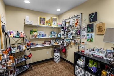 Small shop with various items and decorations.
