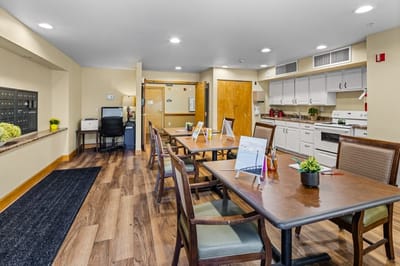 Interior view of a common area with tables and chairs