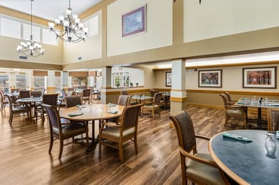 Dining room with tables and chairs set up