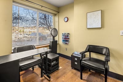 Interior of a small room with seating and decor.