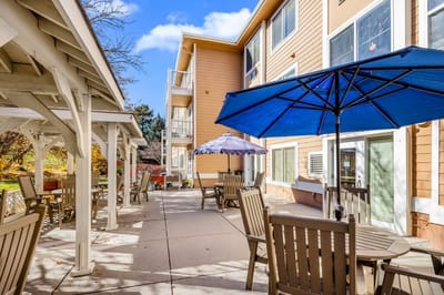 Outdoor patio area with seating and umbrellas
