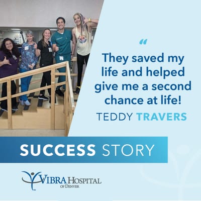 Healthcare staff and a patient celebrating a success story.