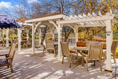 Outdoor seating area with pergola and tables