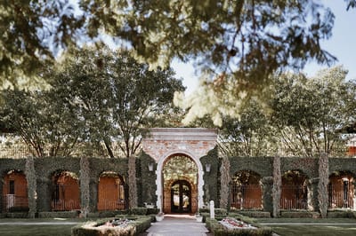 Beautiful entrance to Villa Siena surrounded by greenery.