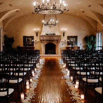 Elegant interior setup with chairs and candles.