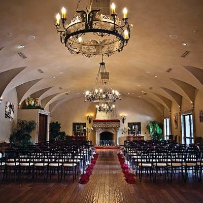 Elegant interior with chandeliers and seating arrangement