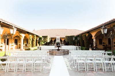 Outdoor courtyard set up for a ceremony