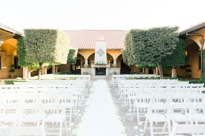 Beautiful outdoor ceremony space with neatly arranged chairs