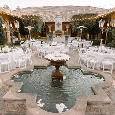 Outdoor dining setup around a fountain