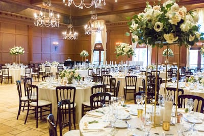 Elegant dining setup with floral arrangements.