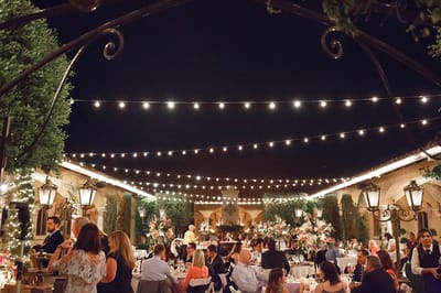 Outdoor event with dining and decorations