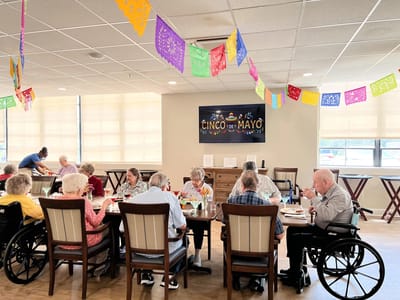Residents enjoying a Cinco de Mayo celebration with food.