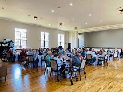 Residents enjoying a group activity in a spacious common area.