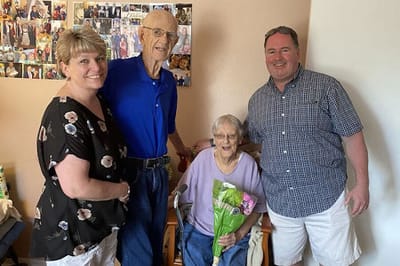 Residents and visitors smiling in a common area