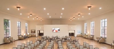 Spacious common area with chairs and lights