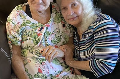 Two female residents smiling together
