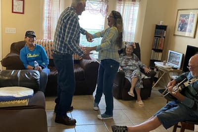 Residents enjoying a social gathering in a common area.