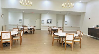 Dining room with tables and chairs set up