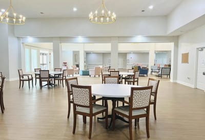 Open common area with tables and chairs