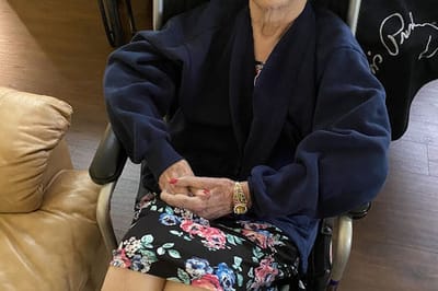 Resident in a wheelchair enjoying time indoors.