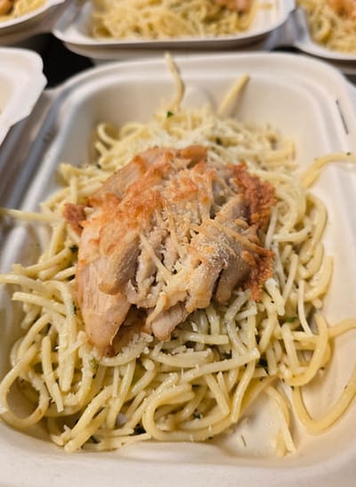 Plate of chicken and spaghetti meal
