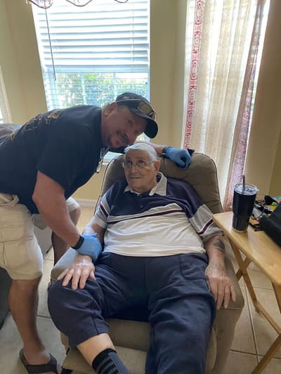 Caregiver with senior resident in living room