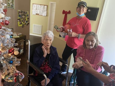 Residents celebrating in a decorated common area.