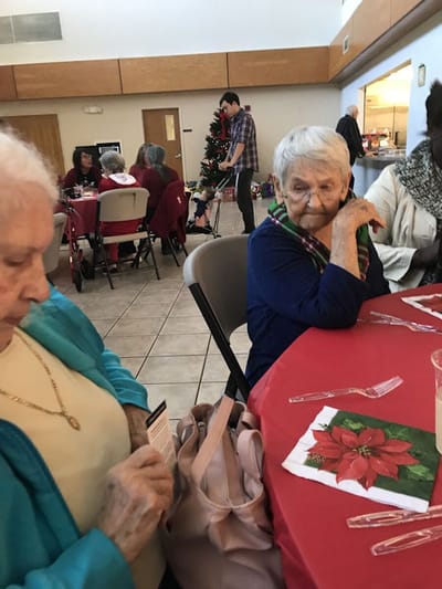Residents enjoying a holiday celebration indoors