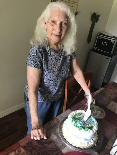 Resident celebrating with a birthday cake.